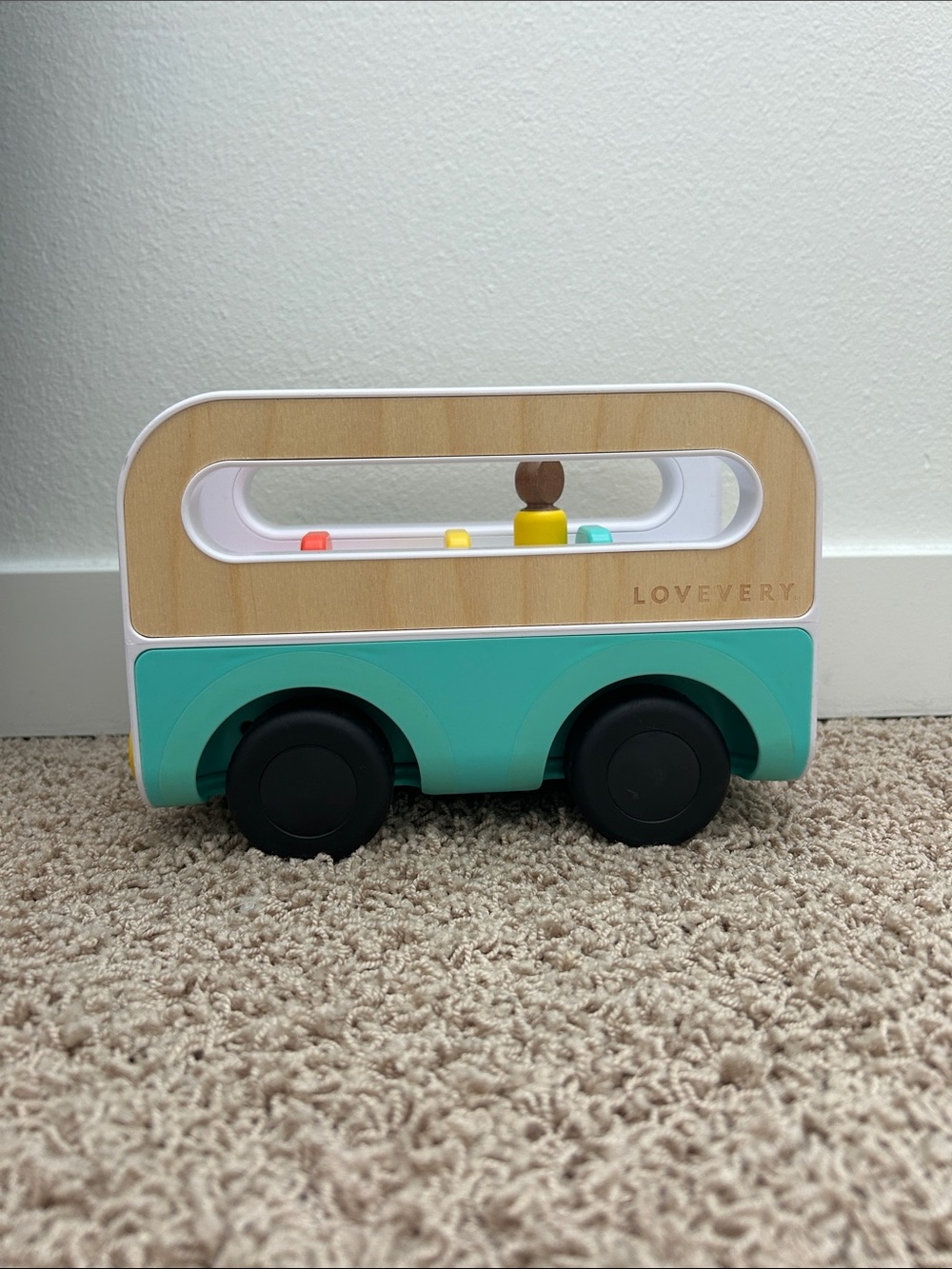 Teal Lovevery Wooden Toy Bus with Peg Passengers